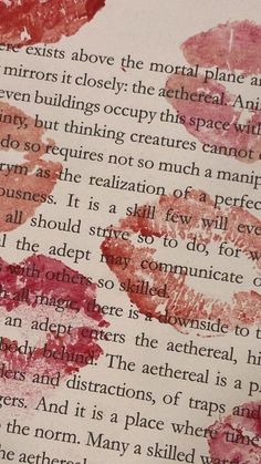 an open book with pink and red lipstick on it's pages, including the words