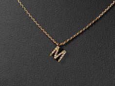 "Mini paved initial necklace makes a unique and personalized gift that sure to surprise and delight just about anyone on your list. 🤍This stylish pendant necklace features a mini monogram with bamboo textured initial is an ideal gift for moms, sisters, daughters, hostesses - and even yourself! - it's a way to reflect one's individuality with an added touch of charm.   🤍Size:  Chains- 16 \"with 2\" extension Pendant: 0.2\" height and 0.2\" wide. 🤍Our jewelry comes in gift boxes. You can add pe Letter M Necklace, M Initial, Bamboo Texture, Initial M, M Necklace, Monogram Pendant, Letter M, Birthday Gift For Her, Necklace Personalized