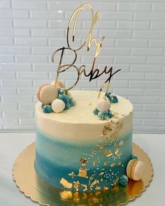 a blue and white cake sitting on top of a table