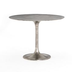 an image of a table that is made out of metal and has a round base