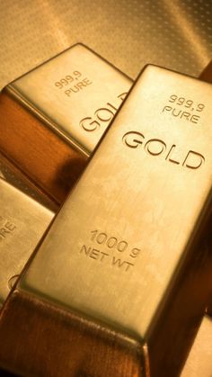 gold bars are stacked on top of each other