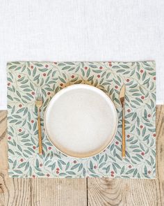 an empty plate and fork on a place mat