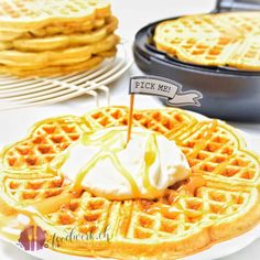 some waffles and ice cream are on a table