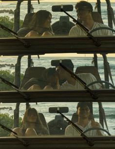 two people are kissing in the back of a vehicle