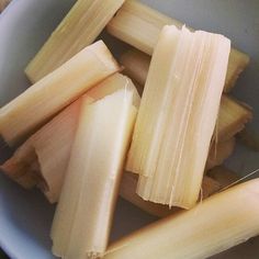 several pieces of banana sitting in a white bowl