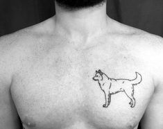 a man with a dog tattoo on his chest