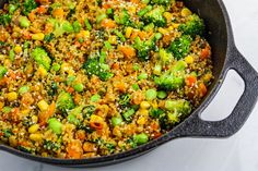 broccoli and other vegetables are mixed together in a skillet on the table