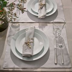 the place setting is laid out with silverware and napkins