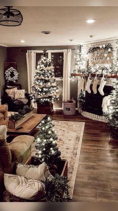 a living room filled with furniture and christmas trees