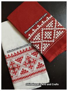 two red and white napkins sitting next to each other on top of a table