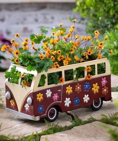 a toy bus with flowers in the back