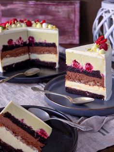 two slices of cake on plates with forks