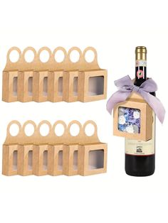 a bottle of wine and six small cardboard boxes with rings around the bottom, tied with a purple ribbon