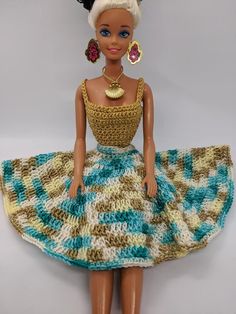 a barbie doll wearing a dress and earrings