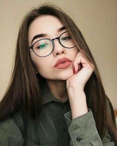 a woman wearing glasses with the words i love you in russian