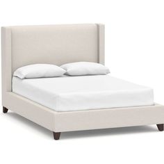 a bed with white linens and pillows on it's headboard, in front of a white background