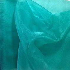 "Crystal Organza fabric is 59/60\" wide, available in an assortment of beautiful colors and sold by the yard. This fabric is frequently used for event decorations, apparel and other crafts projects. Our competitively priced organza fabric is available in bulk to fulfill orders of any size. This Fabric is 59/60\" in width. Each order comes in 1 full length piece. For example, if you order a quantity of 5, you will receive a 5 yard piece measuring 59/60\" x 180''. If you order a quantity of 15, yo Dress Sewing Tutorials, Fashion Crafts, Diy Crystals, Organza Fabric, Sheer Material, Sequin Fabric, Sheer Fabric, Spring Green, Sparkling Crystal