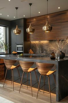 modern kitchen with bar stools and marble countertops