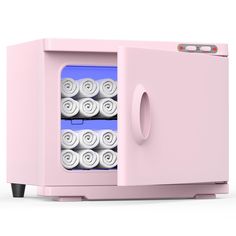 a pink microwave oven with rolls of toilet paper in it