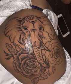 an elephant with roses on it's stomach