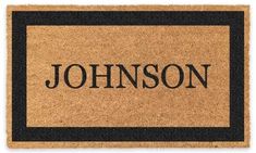 a door mat that says,'johnson'in black and tan with a border