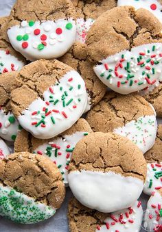 cookies with white frosting and sprinkles on them