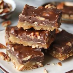 several pieces of chocolate and nuts on a plate