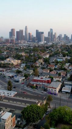 an aerial view of a city with tall buildings