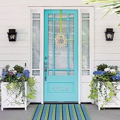 the cover of coastal living's 10 decorating ideas, featuring blue doors and potted plants