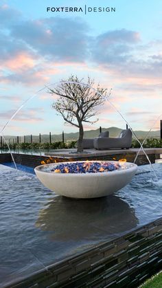 a large bowl sitting on top of a pool