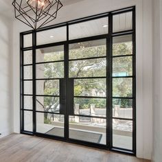 Thermal break iron french double door with sidelight and transom Black Iron Doors Interior, European French Doors, Doors In Living Room, Door With Sidelights And Transom, Wide French Doors, Door With Sidelight, French Doors To Deck, French Doors With Sidelights, Black French Doors