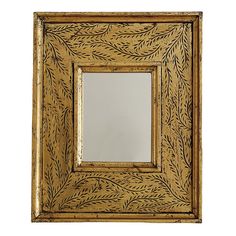 an ornate gold framed mirror with leaves on it's sides and a white background