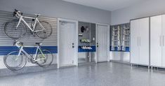 a garage with two bikes mounted to the wall