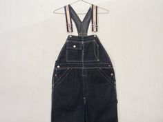 "Vintage 1940s or 50s indigo blue denim overalls, workwear. Has contrasting white stitching, triple stitch seams, hammer loop, button fly, chrome buttons, adjustable shoulder straps and several pockets. Back pocket bottoms are lined in cotton. Labels read: DUBBLE WARE UNION MADE. Actual measurements are: 37\" around the waist 32\" inseam In excellent condition. Never washed, maybe worn once or twice." Vintage Coveralls, White Polka Dot Shirt, Blue Denim Overalls, Lavender Shirt, Denim Coverall, Overalls Vintage, Jeans Overall, Levis Pants, Vintage Workwear