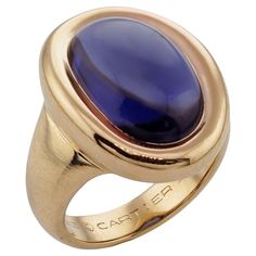 This gorgeous authentic Cartier ring is crafted in 18k yellow gold and bezel-set with an oval purple iolite. Made in France circa 1994. Measurements: 0.47" (12mm) width, 0.86" (22mm) length. The ring size is 6.25 - EU 53. Resizable. Sizing fees will be provided upon request. Excellent condition. Comes with original box. Vintage Cartier Watch, Yellow Gold Cocktail Ring, Iolite Stone, Gold Cocktail Ring, Gold Cocktail, Diamond Cocktail Rings, 18k Yellow Gold Ring, Ruby Ring, Oval Diamond