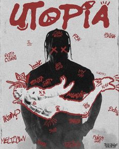 a man holding a cat in his arms with the word utopia written on it's back