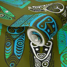 a green and blue wallpaper with an intricate design on it's side,