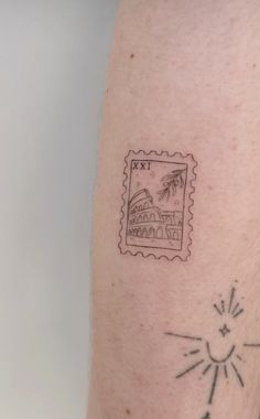 a stamp with the image of a house and palm trees on it's arm