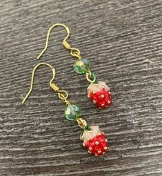 Adorable and petite strawberry earrings. Sweet Nickel-free Dangle Jewelry, Gold Fruit Design Drop Earrings, Gold Drop Earrings With Fruit Design, Cute Green Jewelry With Fruit Design, Sweet Green Jewelry For Gifts, Gold Earrings With Fruit Design For Gift, Sweet Drop Earrings Jewelry Gift, Cute Fruit Design Dangle Jewelry, Cute Fruit Design Jewelry For Gifts