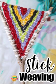 a crocheted triangle sitting on top of a wooden stick with text overlay