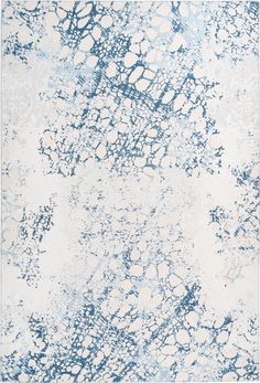 a blue and white area rug with an abstract design