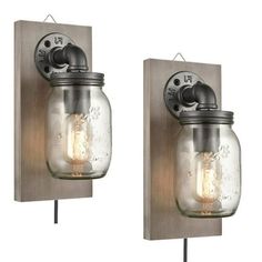 two mason jar lights on a wall mounted light fixture, one with a bulb and the other without