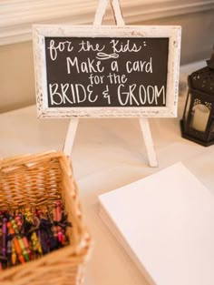 a sign that says for the kids make a card for the bride and groom