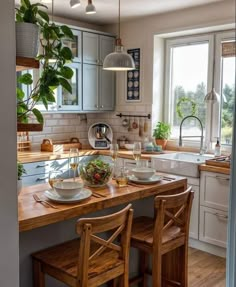 a kitchen filled with lots of counter top space and wooden chairs next to an island