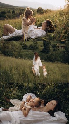 two women laying in the grass with one holding a baby