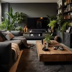 a living room filled with furniture and lots of plants on top of a wooden table