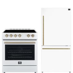 a white stove and refrigerator with gold trimmings on the top, next to each other