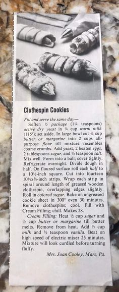 a recipe for glolthspin cookies on a marble counter top with the recipe written in black and white