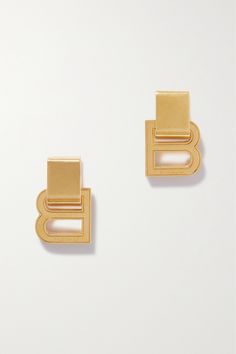 These dangling 'Hourglass' earrings serve as a reminder that 'B' stands for Balenciaga. They've been made in Italy from gold-tone metal and have chunky posts strung with engraved letters. You may recognize them from the Spring '23 runway - they were styled with several looks. Balenciaga Earrings, Balenciaga Jewelry, Earrings In Gold, Fashion Jewelry Earrings, Curator Style, Gold Tone Metal, Earrings Gold, Fashion Watches, Jewellery And Watches