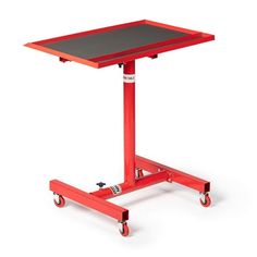 a red table on wheels with a black top